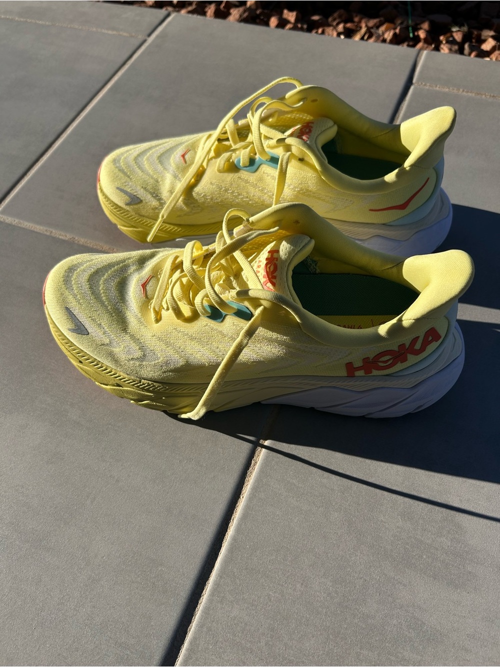 Hoka One One women’s Yellow Athletic Sneakers with Coral Logo. Size 7.5 B